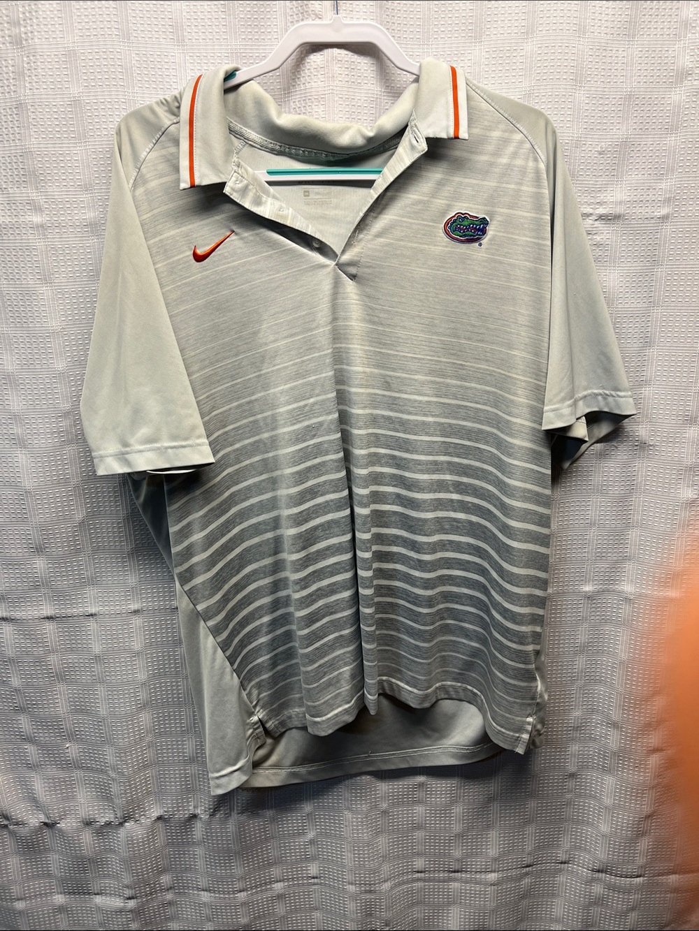 Nike Light Gray Striped Polo with Orange Accents and Team Crest